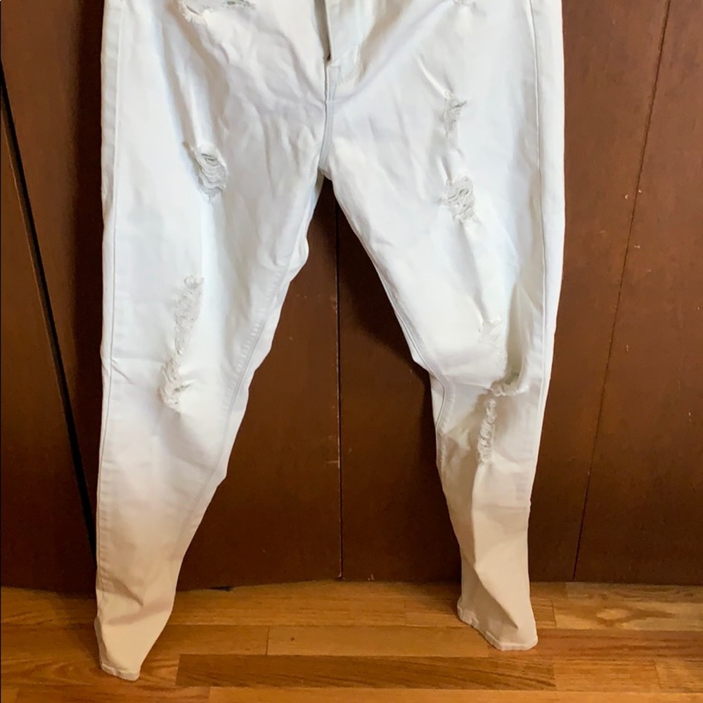 Distressed white jeans